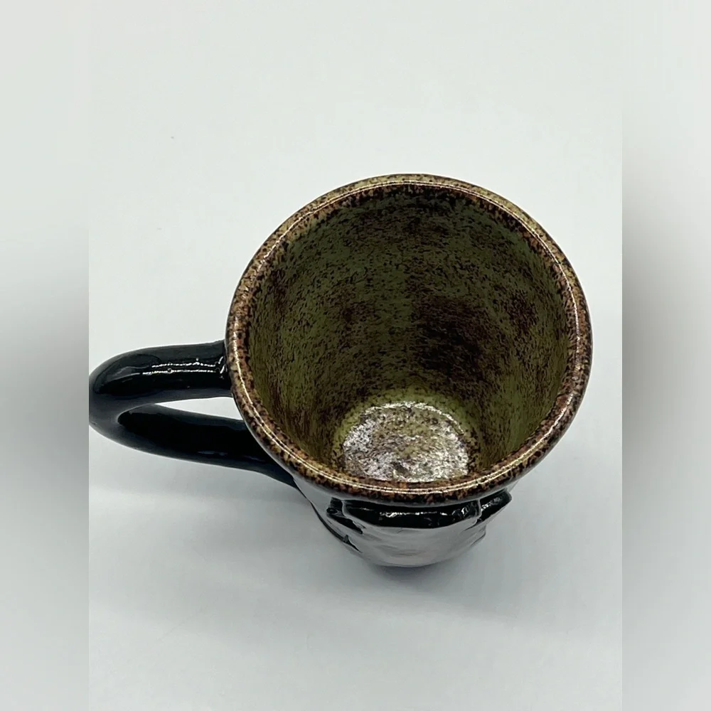 Handmade studio pottery mug with rustic bear design